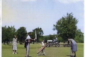 Caddies, one black one white, carrying golf bags for two ladies on the 6th green at Lions Municipal in Austin, Texas. We believe the caddie holding the flag is Alvin Propps, who at 9 years old desegregated the golf course in 1950, creating a civil rights landmark as the first golf course, and likely first public accommodation, in the former Confederate States to be integrated