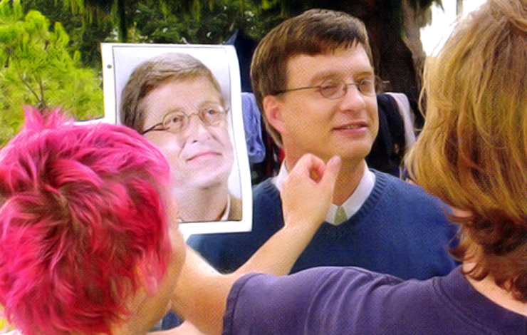 Steve Sires' resemblance to Bill Gates is polished and made ready for the camera by director Brian Flemming on the set of the film 'Nothing So Strange.'
