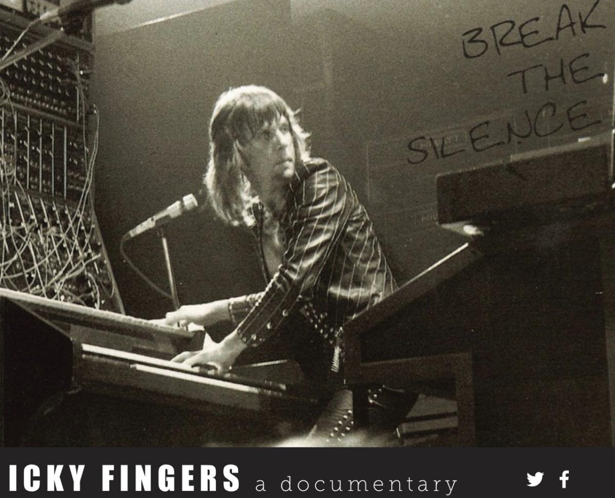 Keith Emerson is playing the piano during a concert.