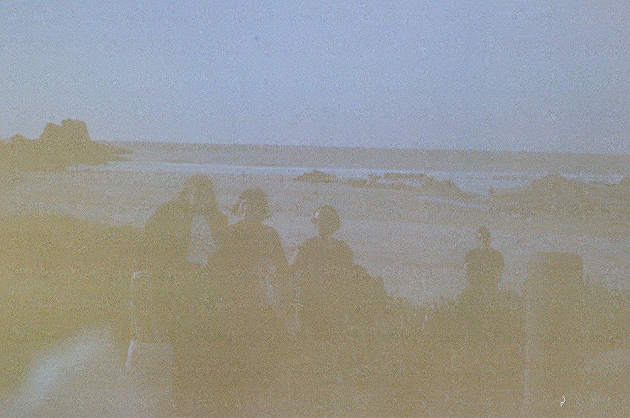 An artfully obscured photo of a group of people in an outdoor setting. 