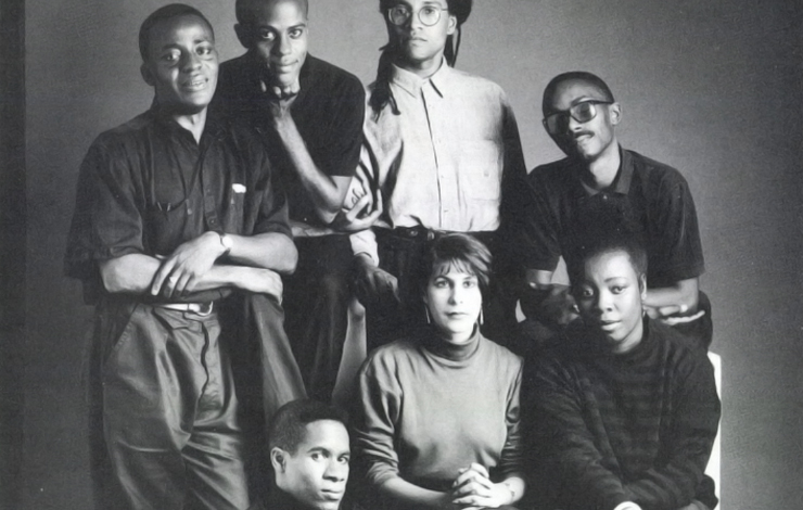 A black and white portrait shot of seven members of the Black Audio Film Collective. 