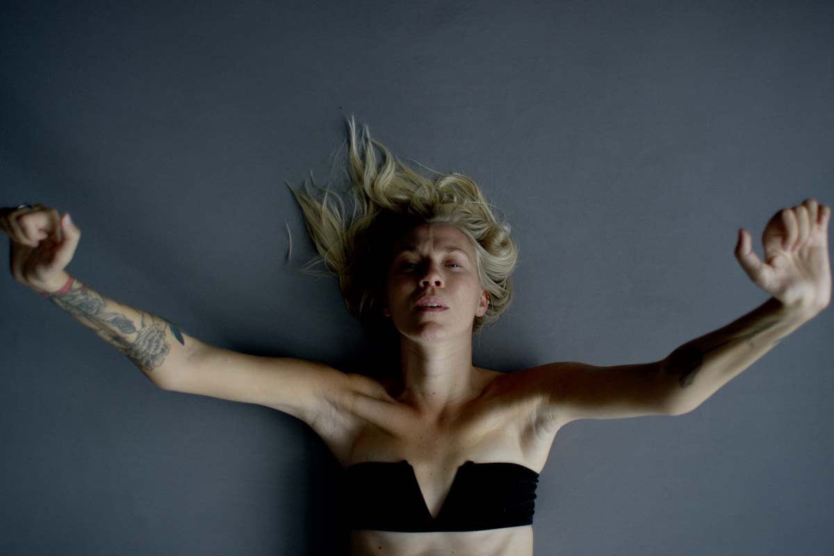 Kelsey Peterson is a white woman seen here lying on her back, wearing a black bandeau. From Peterson’s ‘Move Me.’ Courtesy of Full Frame Documentary Film Festival.
