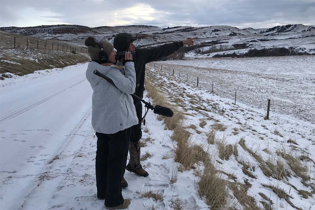 Tsanavi Spoonhunter scouting with Prinz Three Irons, of the Crow Tribe of Montana, at the Wyoming/Montana border for ‘Crow Country: Our Right to Food Sovereignty.’ Photo courtesy of Tsanavi Spoonhunter.