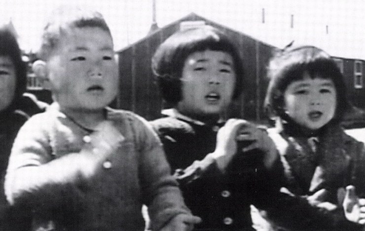 A black-and-white photo of Asian-American toddlers from 'Something Strong Within', a film directed and edited by Robert A. Nakamura, produced and written by Karen L. Ishizuka.