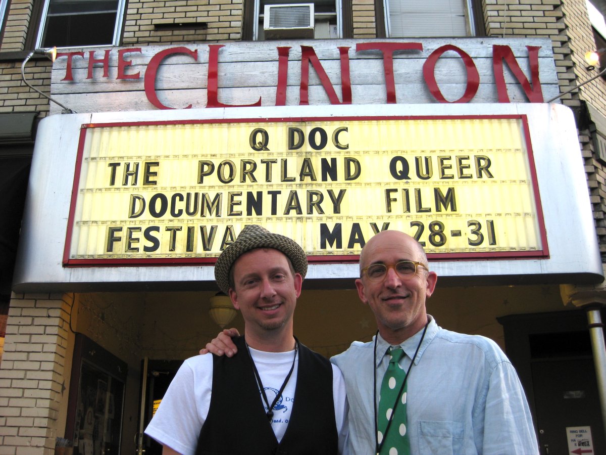QDoc founders Russ Gage (left) and David Weissman stand in front of the Clinton theater marquee in Portland. Courtesy of Weissman.