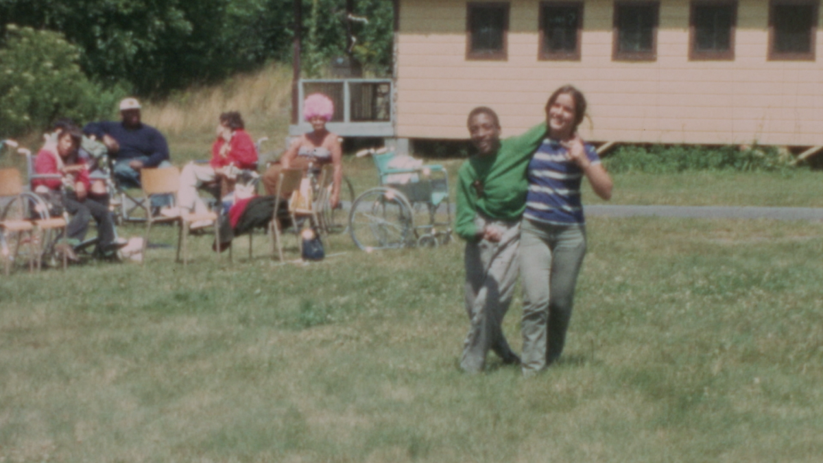 Teenagers living with disabilities enjoying their afternoon out on a field at Camp Jened. From James Lebrecht and Nicole Newnham's 'Crip Camp.' Courtesy of Netflix.