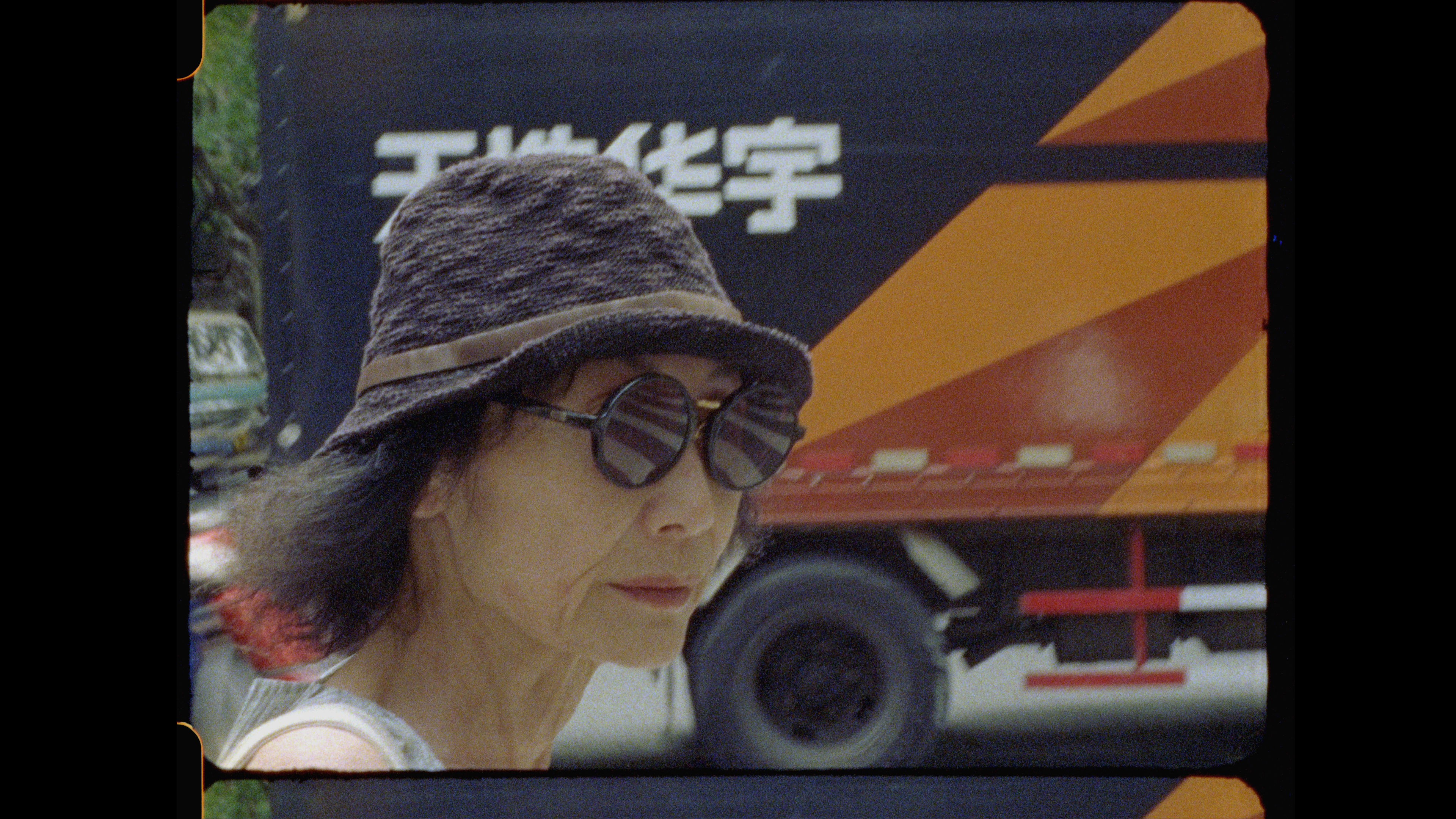 Christine Choy, a Chinese American woman wearing a hat and sunglasses, in Shanghai in 2017. Photo: Connor Smith 