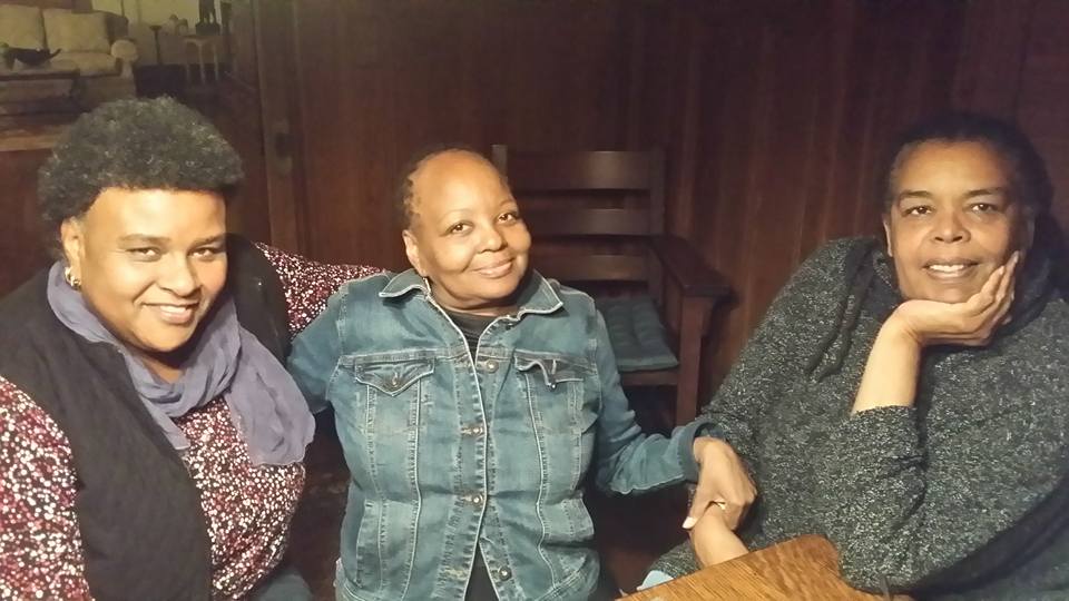 Cinematographer Michelle Crenshaw (left), a Black woman with grey and black scarves over a floral print shirt, and filmmaker Juanita Anderson, a Black woman with a grey sweater, flank Mable Haddock, a Black woman wearing a denim jacket. Courtesy of Juanita Anderson.