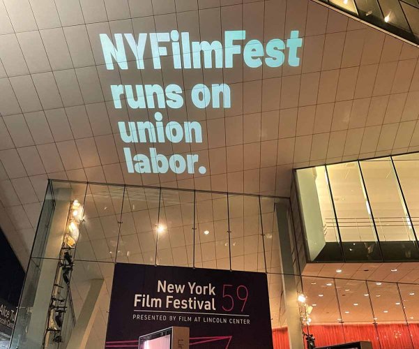 A projection on New York’s Alice Tully Hall reads “NYFilmFest Runs on Union labor.” Image from New York Film Festival 2021; courtesy of FLC Union.