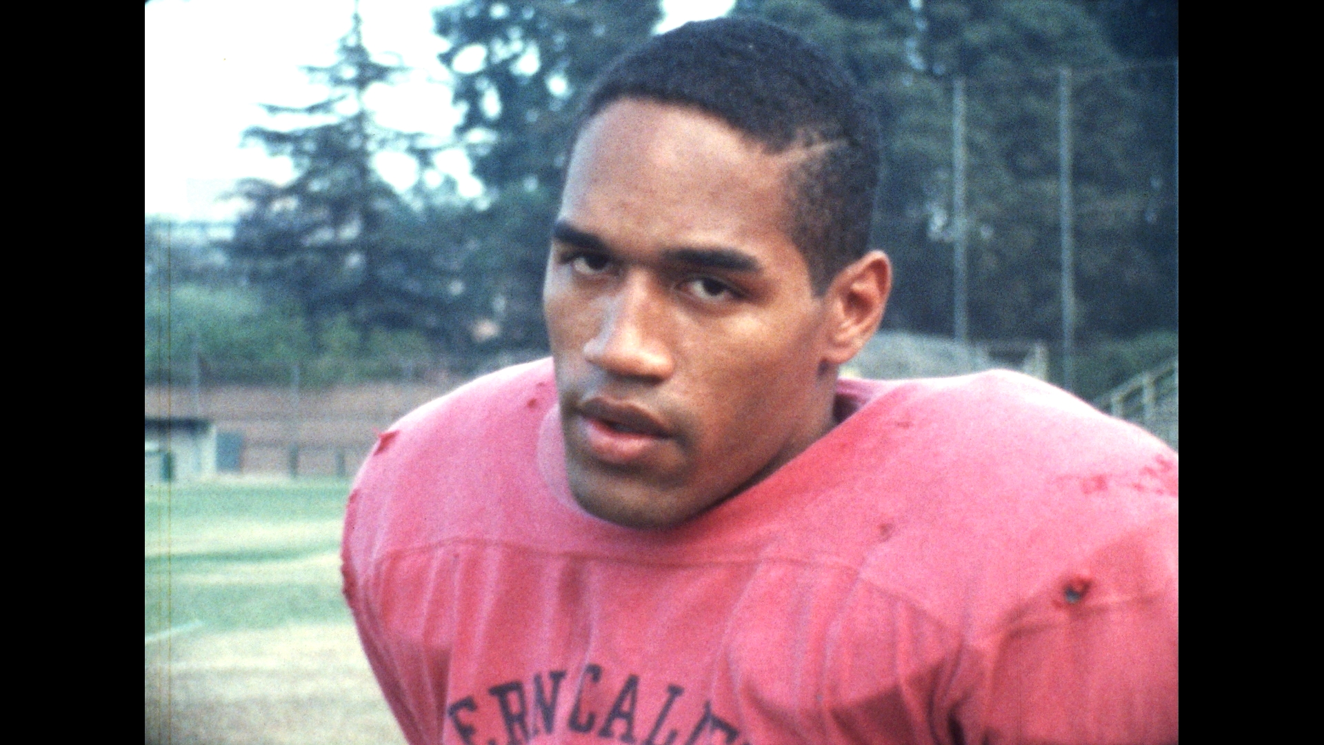 OJ Simpson in a red jersey.