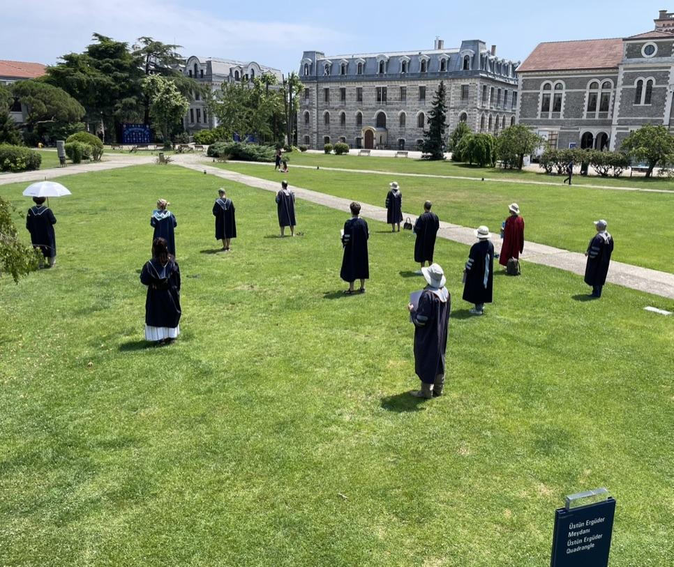 Boğaziçi University faculty standing vigil #615 on the lawn of the school wearing faculty graduation robes