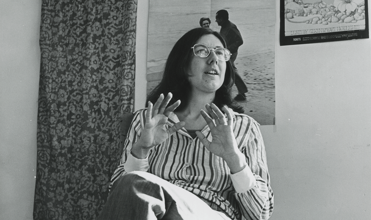 Julia Reichert, a white woman with shoulder-length brunette hair and glasses, wearing a striped button-down shirt and dark slacks, in the early days of New Day Films. Photo courtesy of New Day Films and Julia Reichert