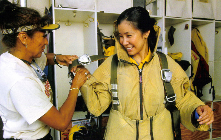 <em>Ultimate Explorer</em> correspondent Lisa Ling, (right) on assignment with smokejumpers in Nepal. Photo: Mark Thiessen/National Geographic Television and Film.