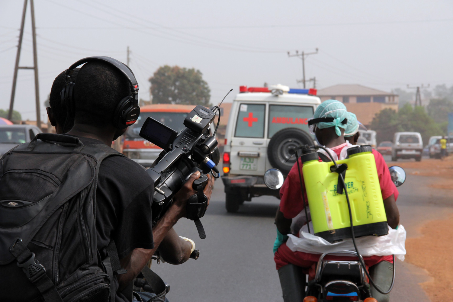 'Survivors' co-director Arthur Pratt holding camera on the back of an Okada. Courtesy of  WeOwnTV Freetown Media Center