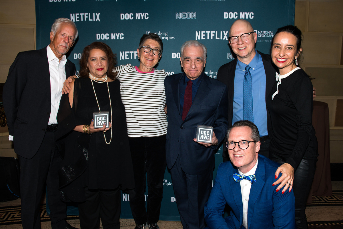 DOC NYC founders Rachaela Neihausen (top row, far right) and Thom Powers (bottom row, far right) with DOC NYC Visionaries.  Left to right: Michael Apted, Cynthia Lopez, Julia Reichert, Martin Scorsese, Steven Bognar, Raphaela Neihausen, Thom Powers. Courtesy of DOC NYC 