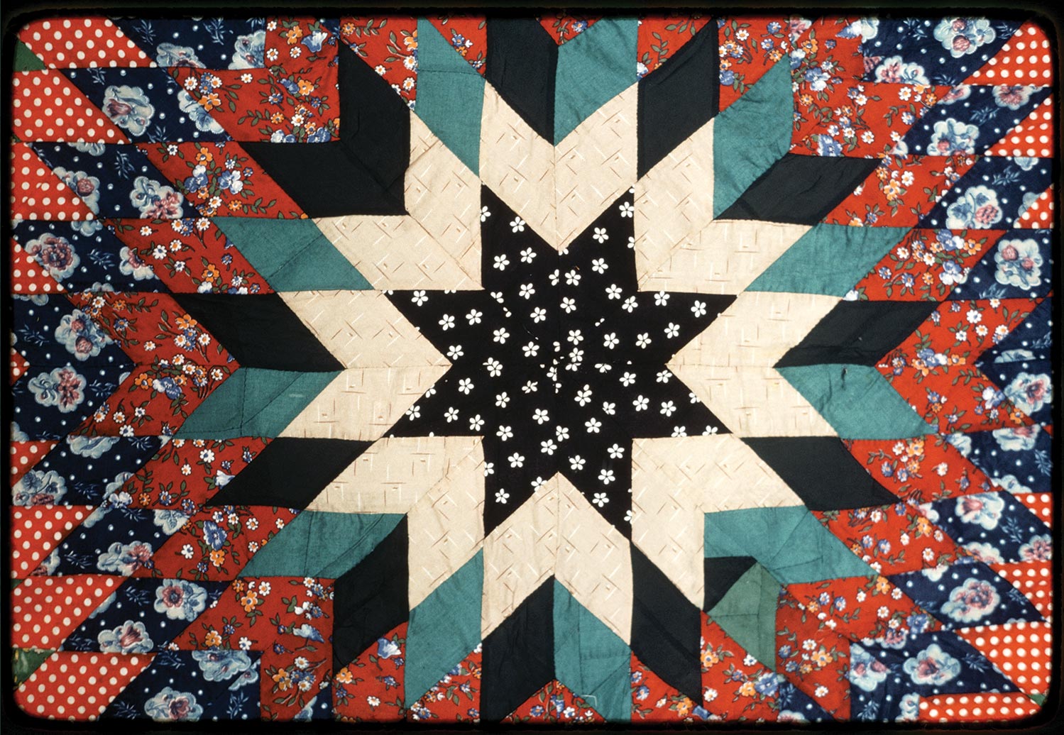 A Lone Star quilt created by Mrs. Sam T Smith. Photo by Geraldine Niva Johnson. Image retrieved from American Folklife Center at the Library of Congress.