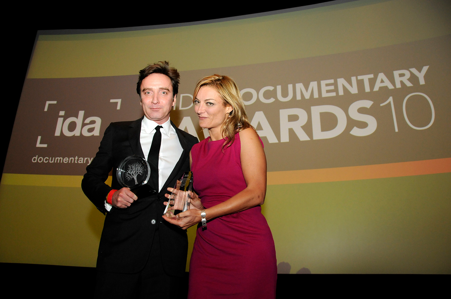 Filmmaker Lucy Walker and Producer Angus Aynsley accept the Pare Lorentz Award for 'Waste Land' at the 2010 Documentary Awards