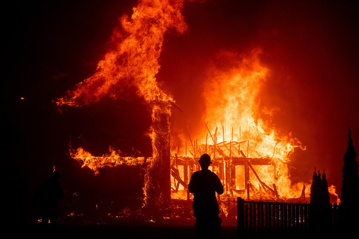 A home burns as the Camp Fire rages through Paradise, CA. Fomr Ron Howard's 'Rebuilding Paradise.' Photo: Noah Berger. Courtesy of National Geographic