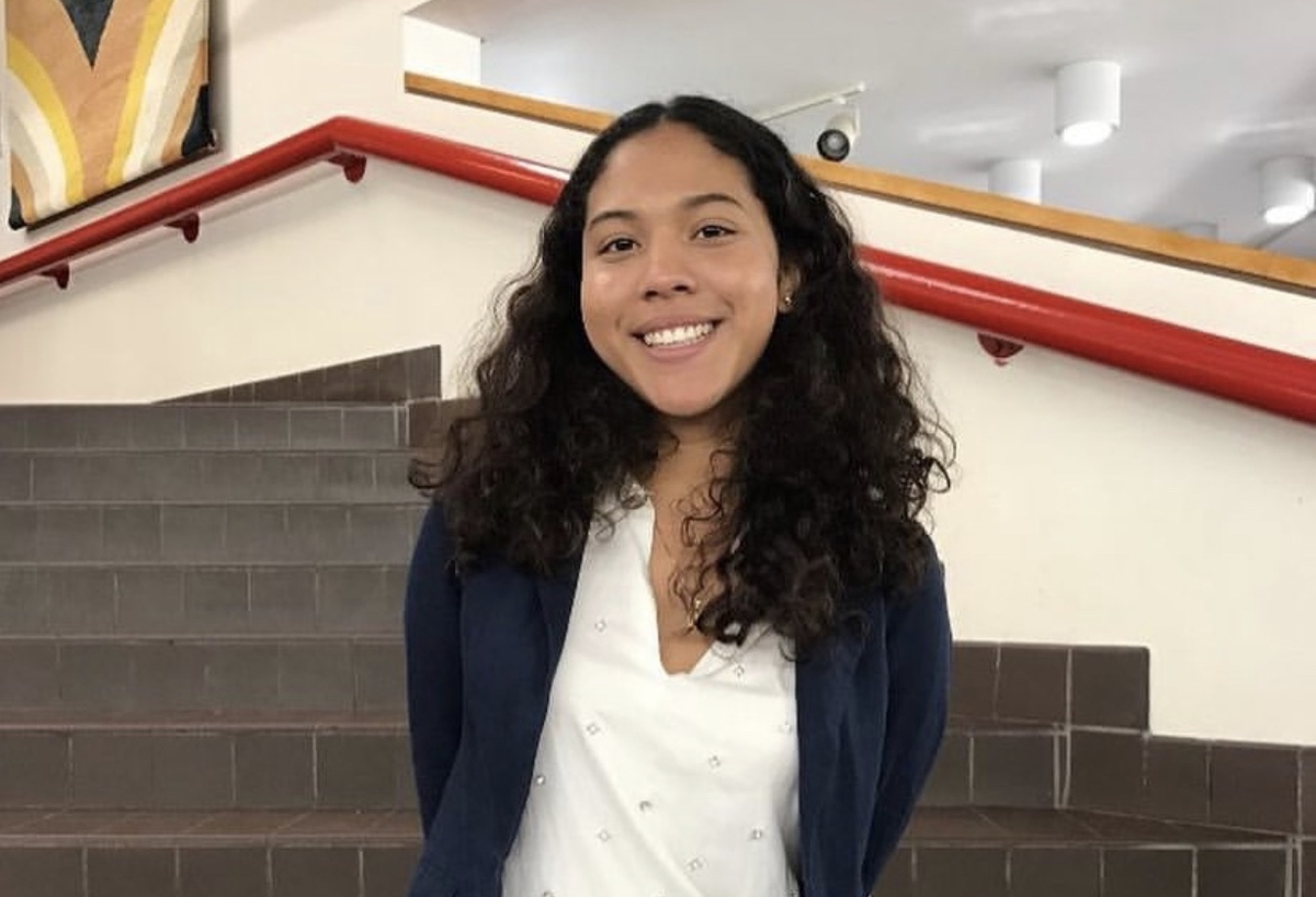 Arlet Guallpa, one of the filmmakers on 'COVID Diaries NYC.' Arlet is a brown-skinned Latina, and she is posing in front of a staircase. Courtesy of HBO
