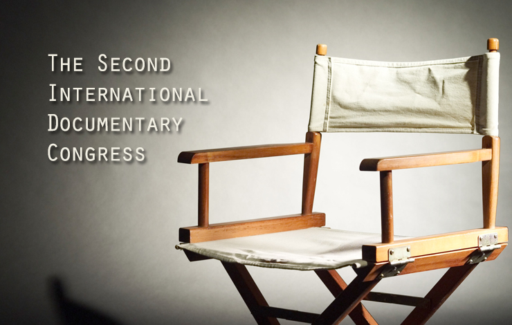 A wooden chair with white fabric. Text overlaid on top reads "The Second International Documentary Congress".