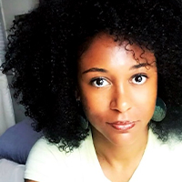 A Black woman with long black hair.