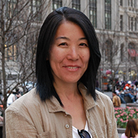 An Asian woman with shoulder length black hair.