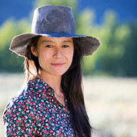 An Asian woman with long black hair.