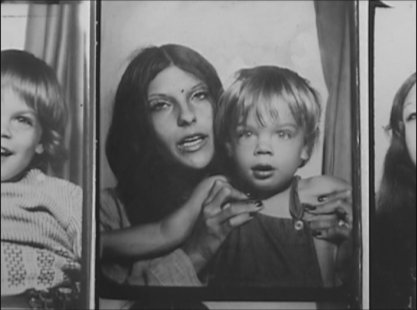 A black-and-white photo booth shot of a mother holding her toddler. Images from Jonathan Caouette’s Tarnation. Courtesy of Wellspring Media and Jonathan Caouette
