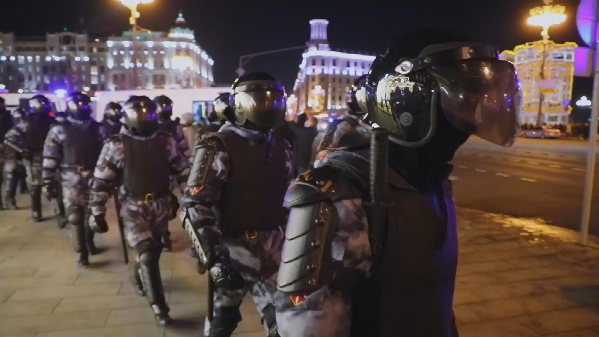 Heavily armed troops, wearing body armor, face shields and helmets, march through the streets of Moscow at night. From Gesbeen Mohammed’s ‘Putin’s War at Home,’ a ‘Frontline’ production currently streaming on PBS.org. Courtesy of ‘Frontline’.