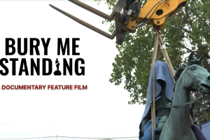 An image of a monument lifted by crane with large black title text reading “BURY ME STANDING” and maroon sub-title text reading "A DOCUMENTARY FILM”
