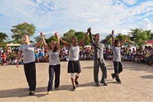 Five Juilliard Dancers performing in The Philippines, in front of a large crowd of children.