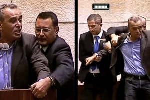 News clip of white man being grabbed by other men.