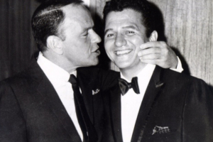 Buddy Greco with Frank Sinatra giving him a kiss on the cheek