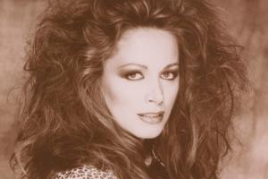 A sepia portrait of Jackie Collins, a white woman with permed hair and a leopard print blouse. Still from ‘LADY BOSS: The Jackie Collins Story’ (Directed by Laura Fairrie, Produced by John Battsek, Lizzie Gillett) Courtesy of Tribeca Film Festival