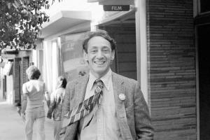 A black-and-white photo of a man smiling from Rob Epstein and Richard Schienchen’s 'The Times of Harvey Milk.'
