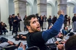 An activist in his wheel chair in the Capital