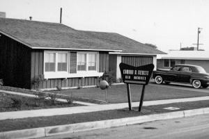 A black and white photograph of a mobile home.