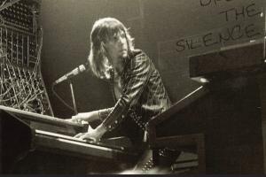 Keith Emerson is playing the piano during a concert.