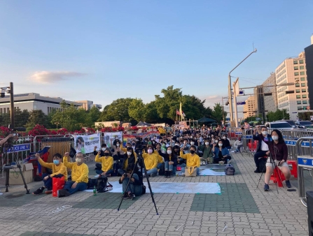 An outdoor protest in a public square.