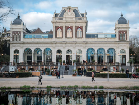 Daytime shot of a pavilion by a lake