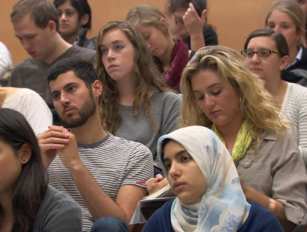 Group of diverse students in a college classroom