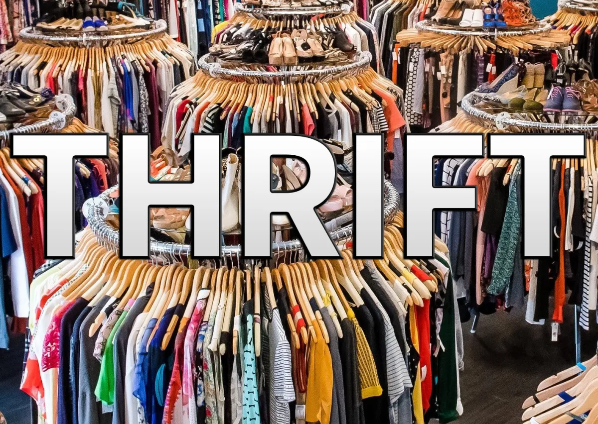 Stacks of clothes at a thrift shop