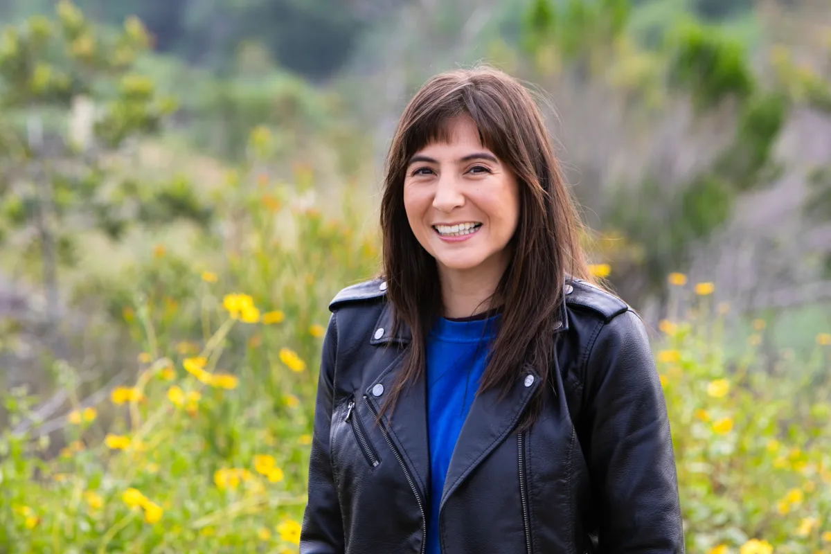 Headshot of Victoria Chalk. Fair skin women with long brown hair.