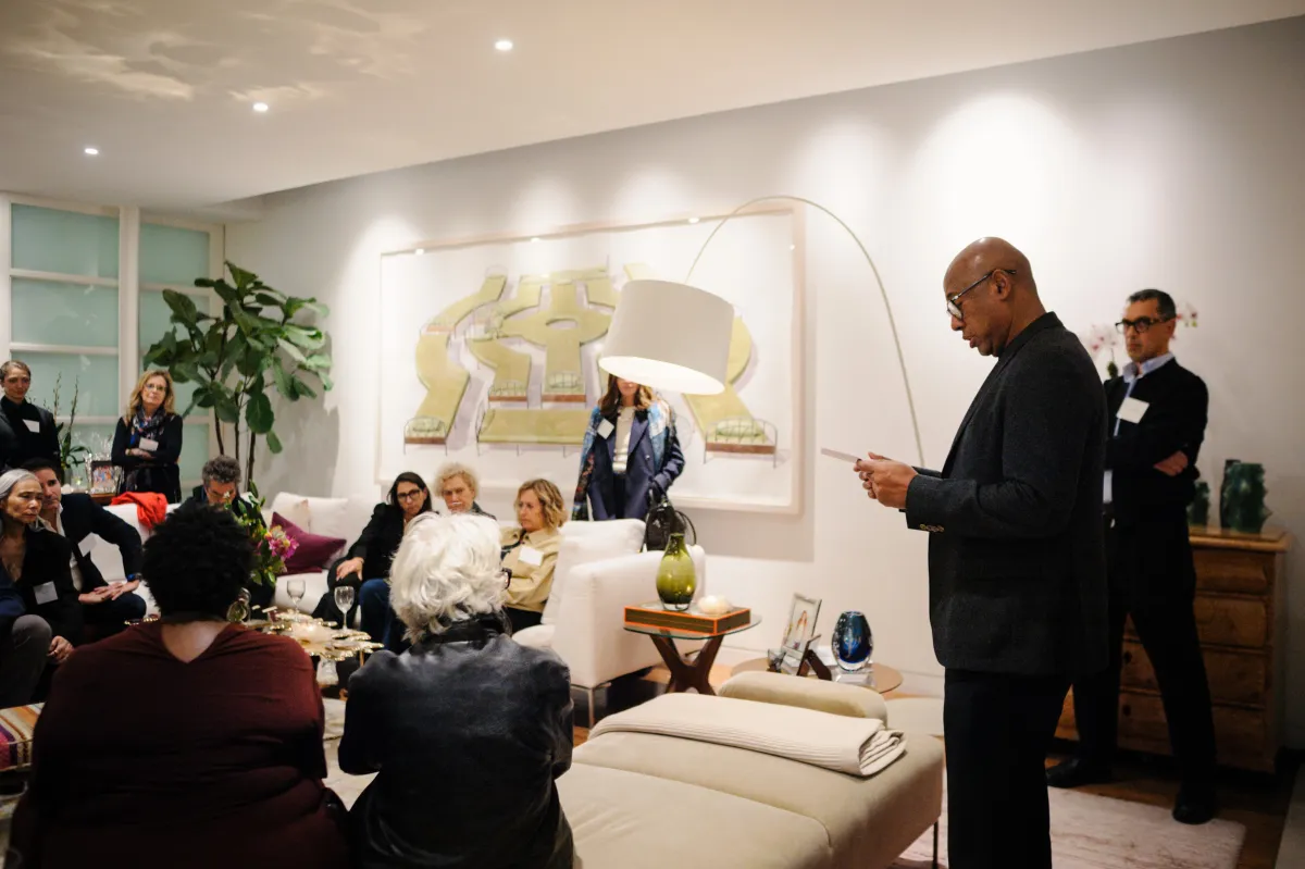 Raoul Peck speaking to people at an IDA member event in New York. November 10, 2025