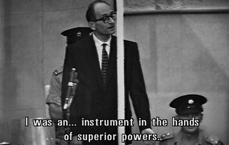A black-and-white photo of a man from 'The Specialist' saying: "I was an...instrument in the hands of superior powers..."