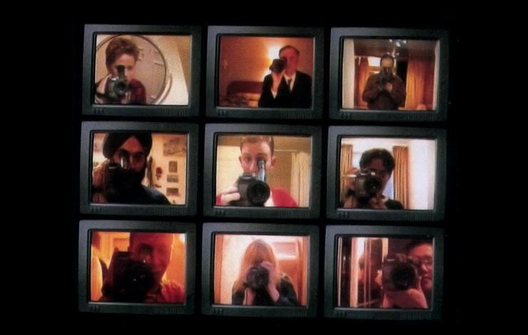 Nine screens show people holding a camera up to the camera.