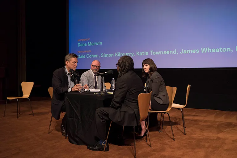 James Wheaton and Simon Kilmurry are sitting across the table from Marco Williams and Katie Townsend.