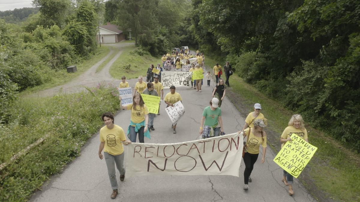 protesters from the town of Minden, WV hold signs about local contamination