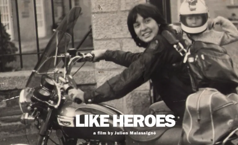 A black and white photograph of a woman and a child on a motorcycle.