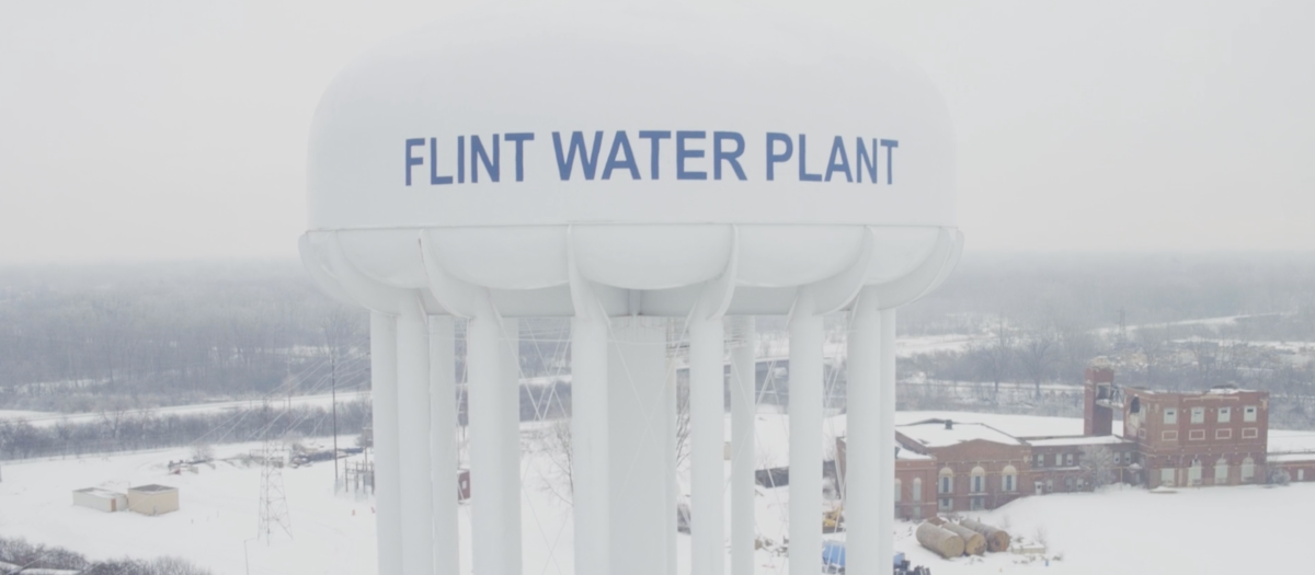 A photo of a water tank labeled 'Flint Water Plant' in the winter. 